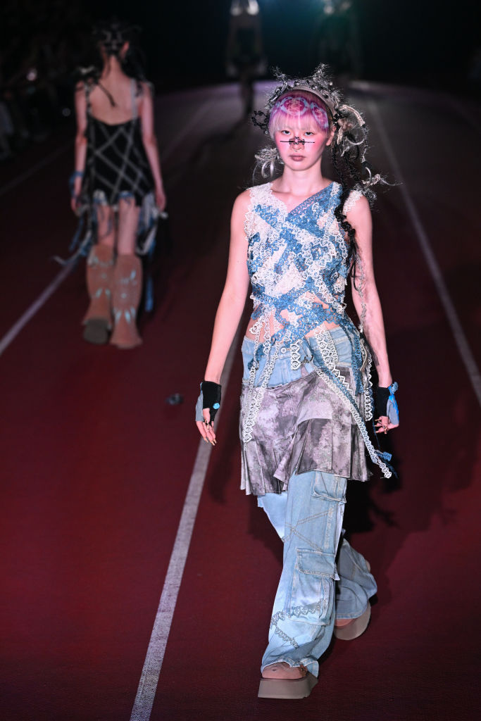 TOKYO, JAPAN - SEPTEMBER 05: A model walks the runway during the YUEQI QI show during Rakuten Tokyo Fashion Week S/S 2025 at Japan National Stadium on September 05, 2024 in Tokyo, Japan. (Photo by Koji Hirano/Getty Images)