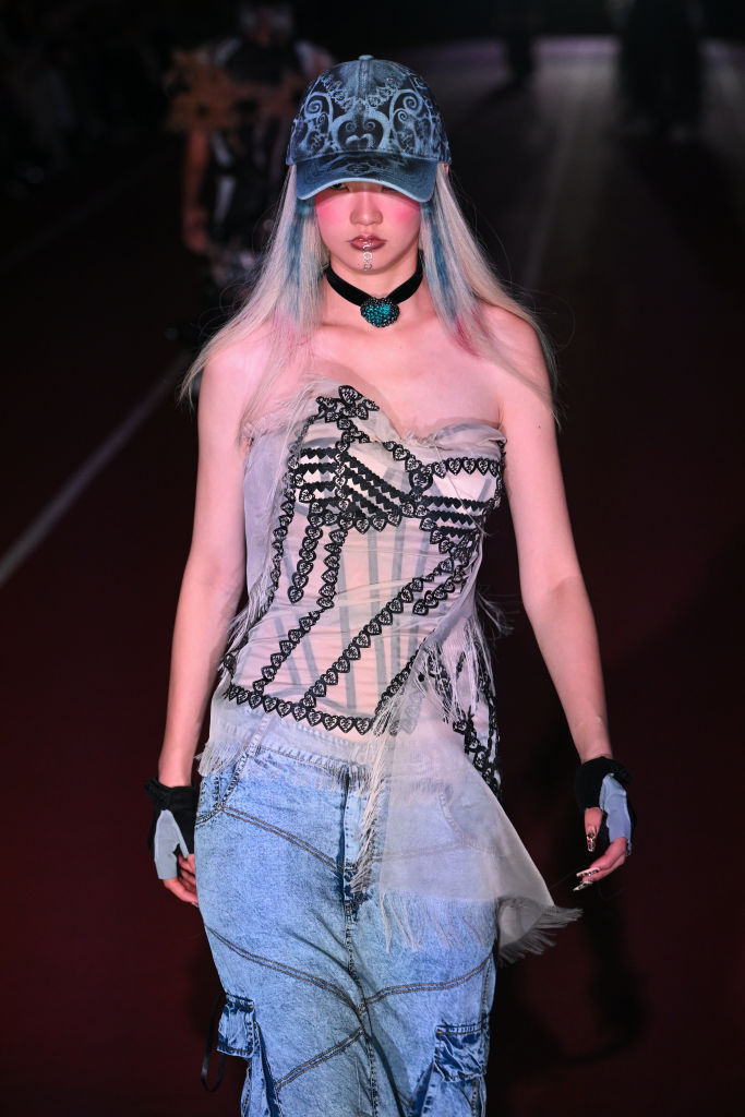 TOKYO, JAPAN - SEPTEMBER 05: A model walks the runway during the YUEQI QI show during Rakuten Tokyo Fashion Week S/S 2025 at Japan National Stadium on September 05, 2024 in Tokyo, Japan. (Photo by Koji Hirano/Getty Images)